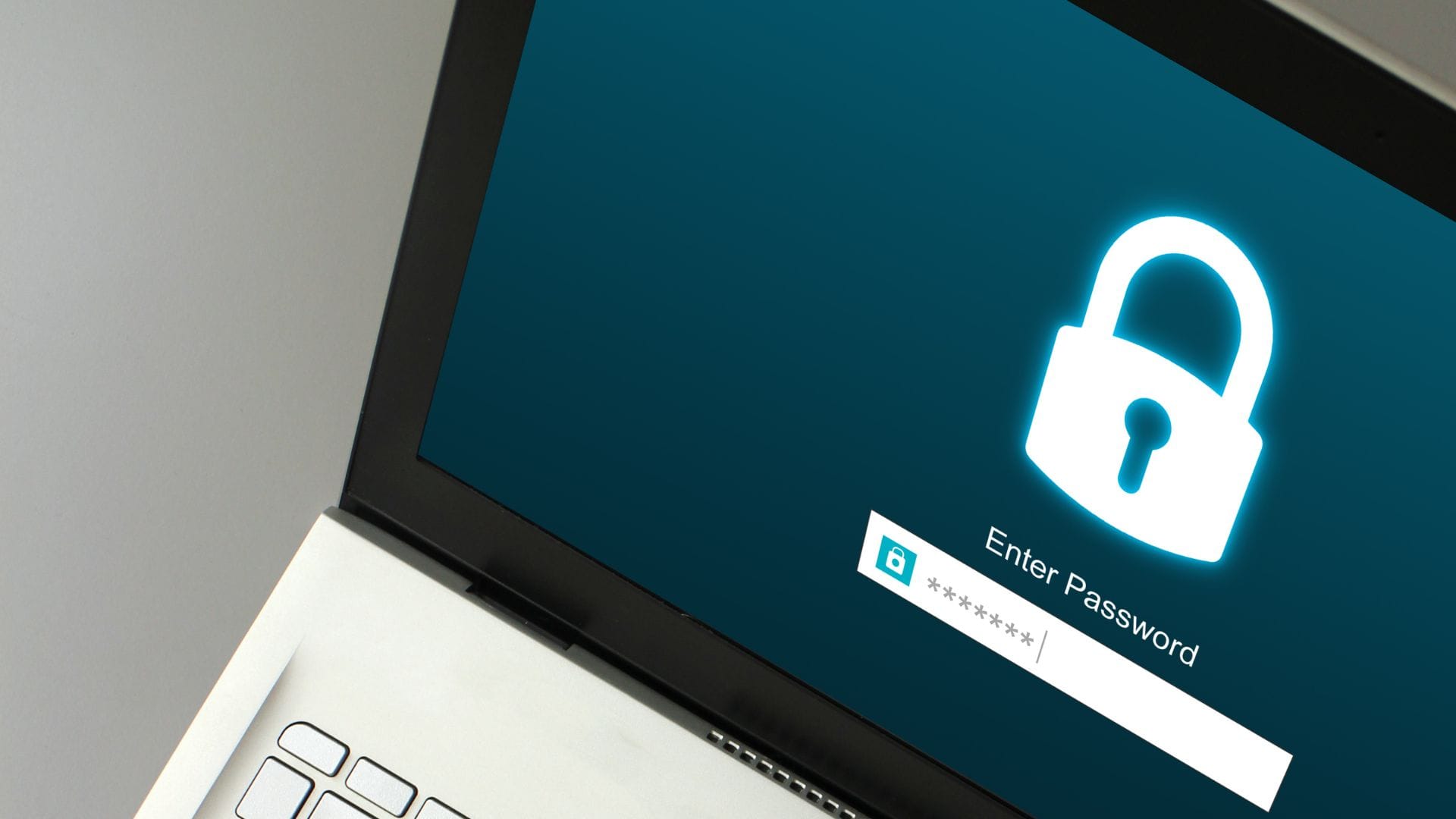 A laptop with a lock screen requiring a password