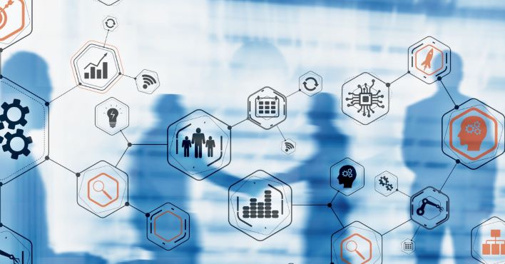Abstract image of interconnected hexagonal icons representing various business and technology concepts, with blurred silhouettes of people in the background.