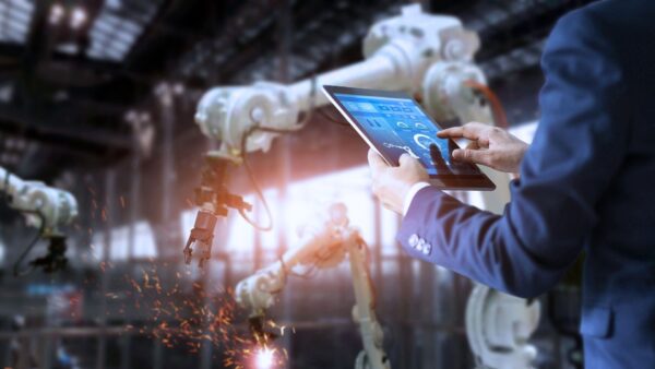 A manufacturer controlling a machine using a tablet